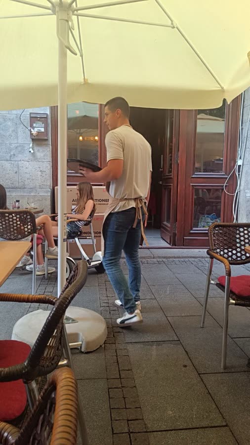 Marko working as a waiter